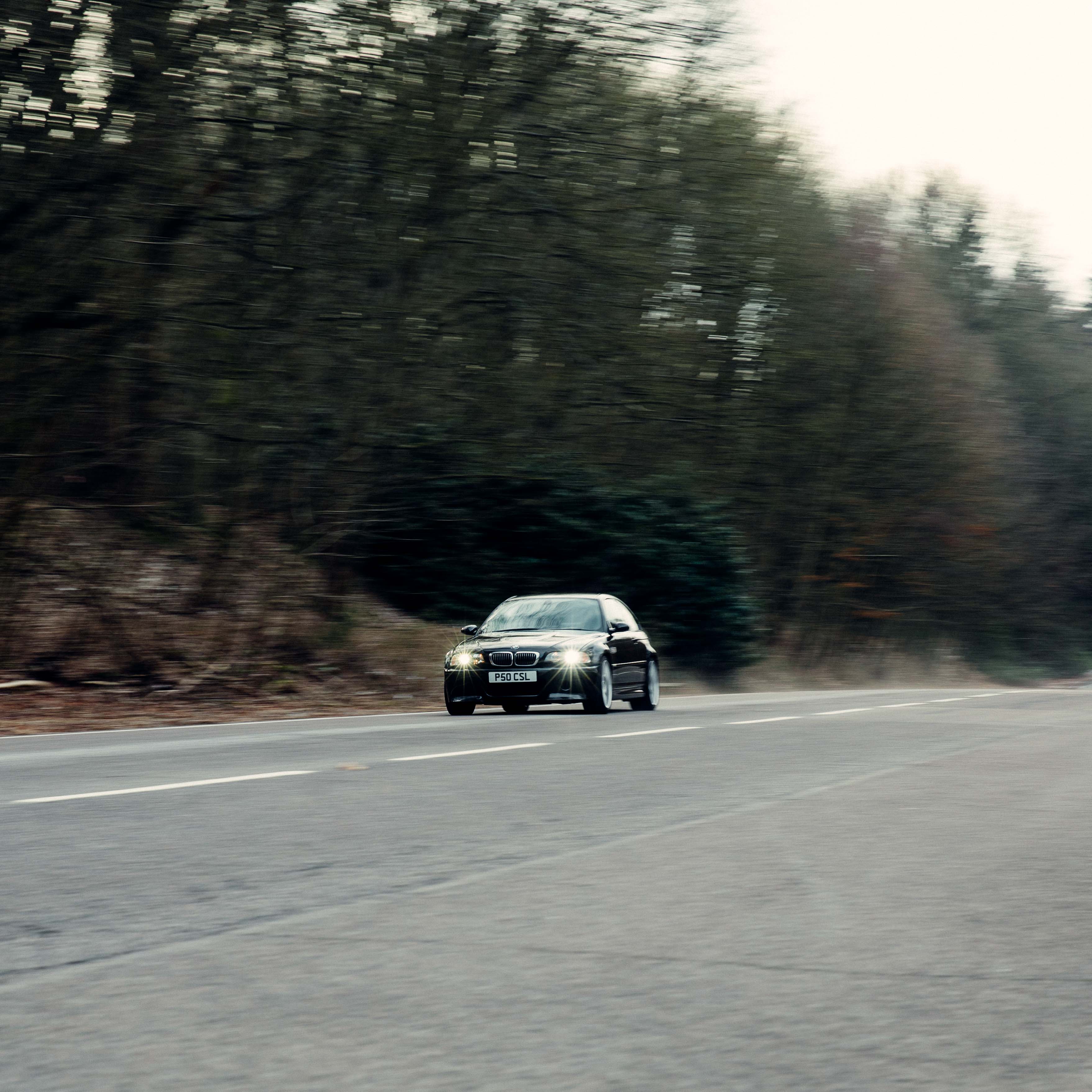 Black bmw e46 m3 csl on the road in the forest – Shooting Brake